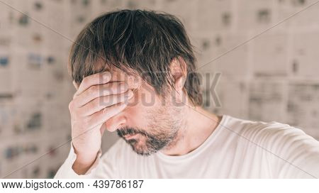 Depressed Man In Infodemic Concept, Adult Male With Head In Hands Crying Confused