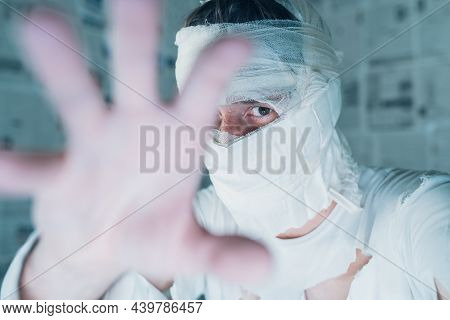 Victim Of Tabloid Journalism And Fake News Infodemic, Conceptual Image Of Man Wrapped In Bandages Su