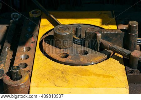 Rebars With Rebar Bending Machine In The Site. Worker Using Bending Rebar Machine For Reinforcement 