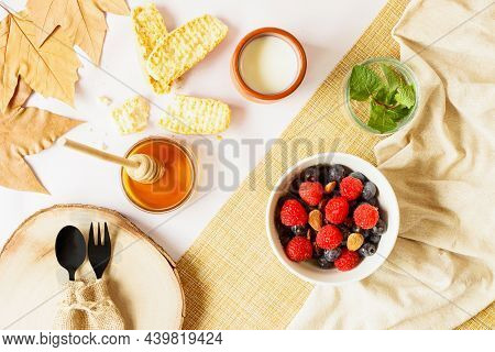 Autumn Style Breakfast With Red Fruits, Nuts, Honey, Milk And Toast