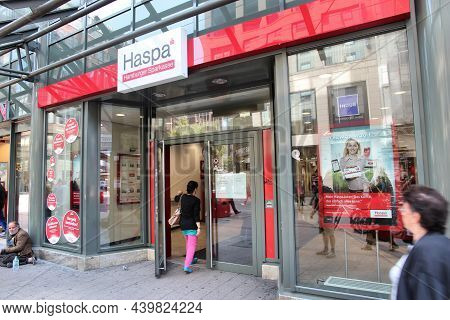 Hamburg, Germany - August 28, 2014: Customer Visits Haspa Hamburger Sparkasse Bank Branch In Hamburg