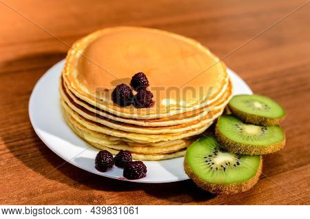 Delicious Pancakes With Honey, Kiwi And Berries.