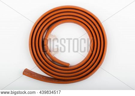 Red Hemostatic Rubber Medical Tourniquet For Stopping Bleeding On A White Background. Tool For Bleed