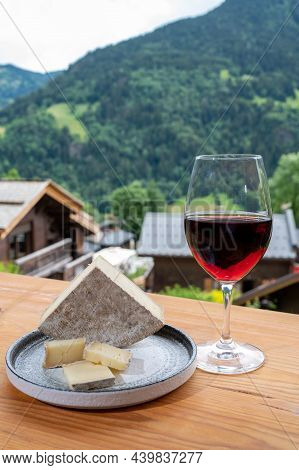 Cheese Collection, French Cheese Tomme De Savoie, Glass Of Red Wine From Savoie And French Mountains