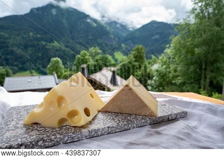 Cheese Collection, Swiss Cow Cheese Emmental And Gruyere And Mountains Village In Apls On Background