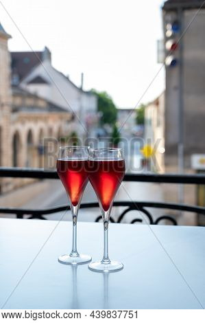 Drinking Of Kir Royal,  French Aperitif Cocktail Made  From Creme De Cassis Topped With Champagne, T