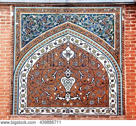Brick wall with mosaics at the entrance to Shrine Ensemble, mausoleum and khaneghah of Sheikh Safi al-din, Ardabil, Iran. UNESCO world heritage site