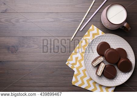 Tasty Choco Pies And Milk On Wooden Table, Flat Lay. Space For Text