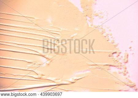 Beige Foundation Smear In Blur On A Pink Background. Beautiful Textured Background For Your Ideas