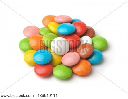 Pile of colorful glazed candy dragees isolated on white