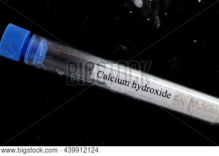 Calcium Hydroxide In Test Tube And Black Background