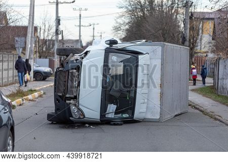 The Truck Is Turned On Its Side And Is Lying On The Street. Accident.