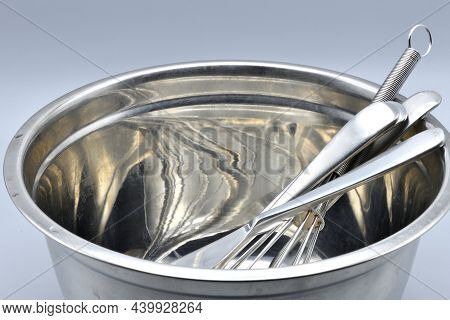 Stainless steel kitchen items used for cooking and preparing.