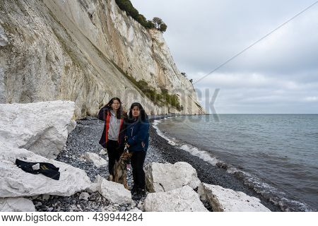 A Mother And Daughter With A Dog In Front Of A Beautiful Chalk Cliff. Picture From Mons Klint In Den