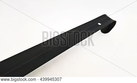 Photo Of A Spoon For Putting On Shoes On A White Background For Use In Advertising.