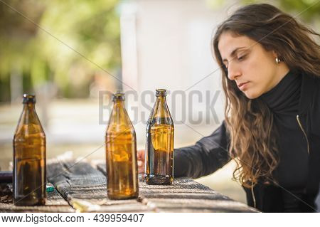 Lonely Woman Drinks Bottle Beer And Thinks About Life Meaning