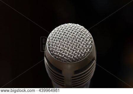 Professional Microphone In A Music Studio On A Black Background. Record Sounds And Songs. Chrome Met