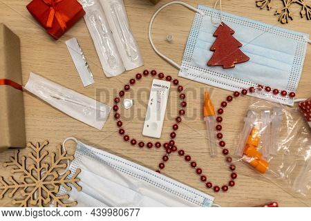 Christmas Decoration And Covid Test With Mask On Table