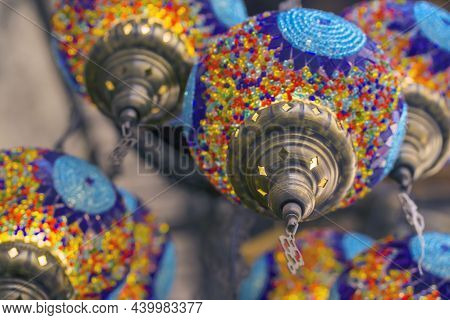 Middle Eastern Lambas Of Different Colors And Sizes Are Hanging In The Bazaar. Bright Traditional Ar