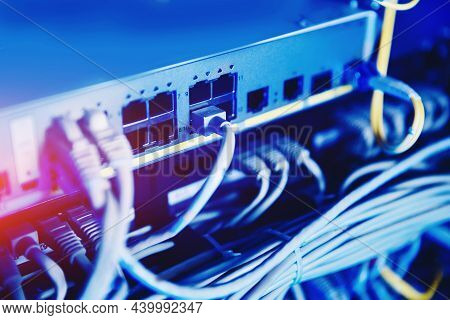 Fiber Ethernet Cable On Network Switches Optical Connector Interface. Concept Internet Data Center B