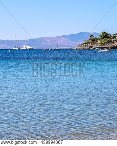 Blue Sea, Islands And Boats On The Aegean Coast. Summer Vacation And Coastal Nature Concept