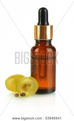 Ripe sliced grape and grapeseed oil, isolated on white