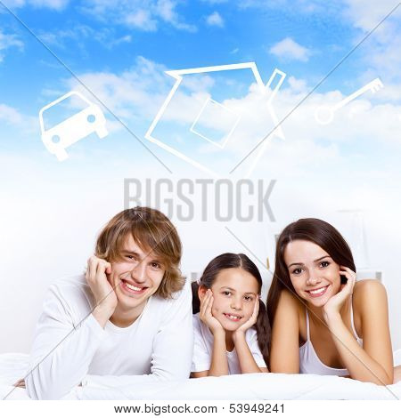 Young family with a daughter and house