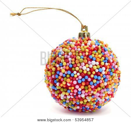 a christmas ball coated with nonpareils of different colors on a white background