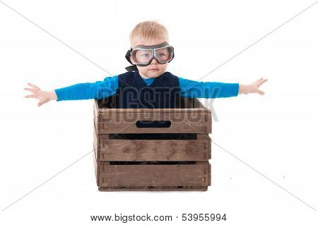 Young Boy Pilot Flying A Wood Box