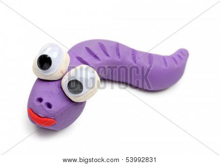 Lilac worm made from child's play clay isolated on white background