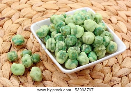 Wasabi peas on white plate