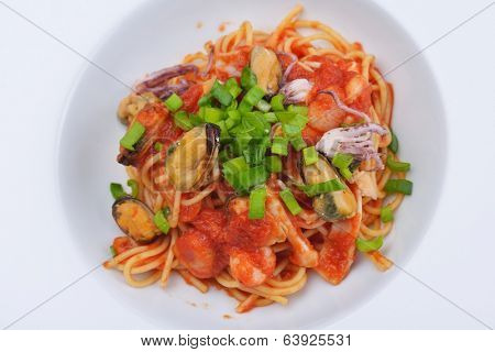 Pasta with shrimps, herbs and mashrooms isolated on white background in studio