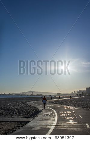 Running Along The Road Beside Seashore In Morning