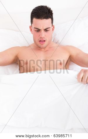 Man Looking Down At His Underwear At His Penis