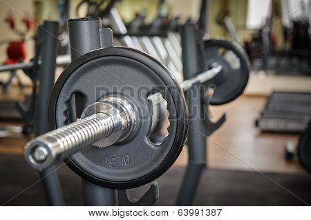 Barbell ready to workout, indooors, shallow DOF