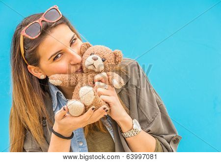 Beautiful  Woman Holding And Kissing Here Small Toy Bear