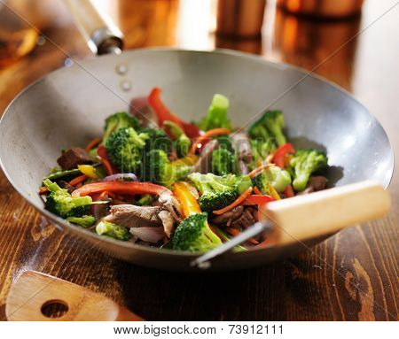 chinese stir fry in metal wok