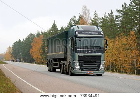 Green Volvo FH Semi Truck On The Road In Autumn