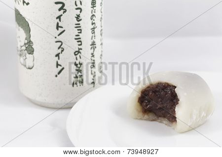Bitten White Mochi and Japanese Tea Cup