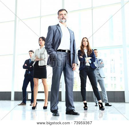 Group portrait of a professional business team looking confidently at camera