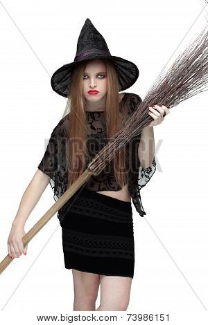 Girl in witch costume with a broom. 2
