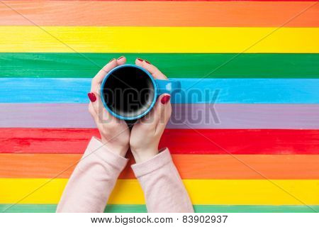 Female Hands Holding Cup Of Coffee