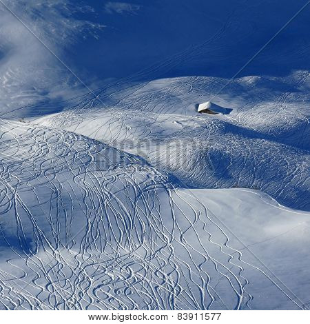 Ski And Snowboard Tracks And Little Hut