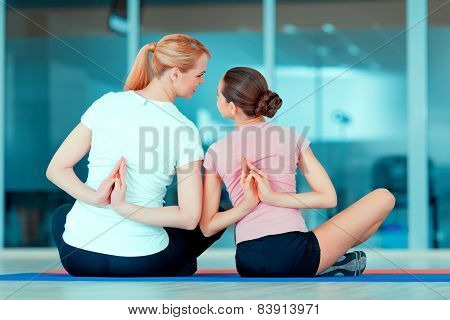 Mother and teenage girl at sports club