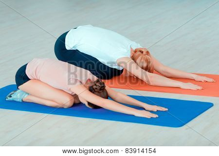 Mother and teenage girl at sports club