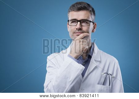 Pensive Doctor With Hand On Chin