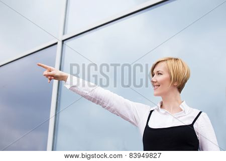 Young Businesswoman Showing Away