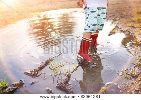 Boy in a puddle
