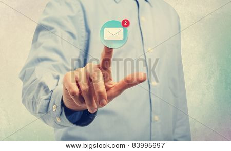 Young Man Pointing At An Email Icon
