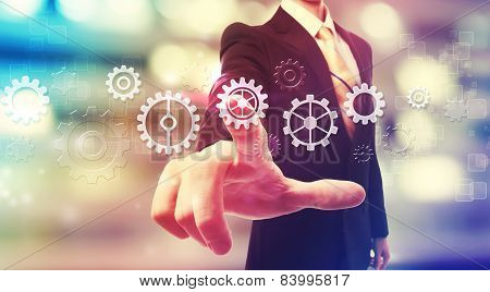 Businessman Pressing Gear Icons
